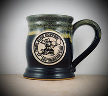 Load image into Gallery viewer, Handmade coffee mug, Best Damn Coffee in the World logo, fighting free bird logo, 15 ounce clay mug, 15 ounce handmade mug, matte balck color with gloss gold rim
